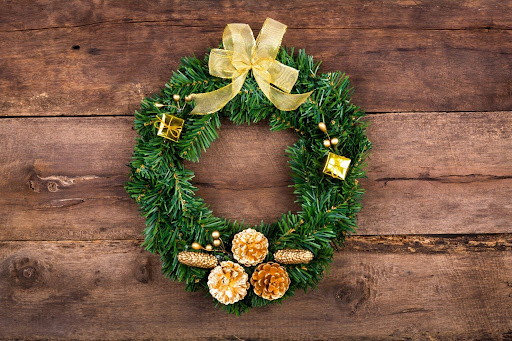 How can you keep your holiday greens fresh and prevent wilted wreaths and drooping garlands?